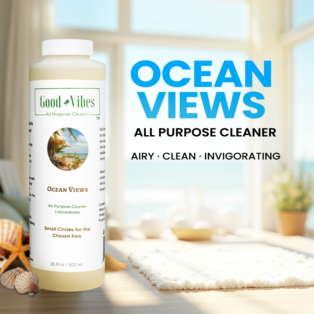 Ocean Views All-purpose cleaner bottle with 'Good Vibes' branding in a room with an ocean view.